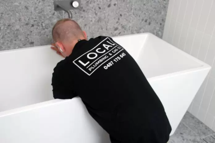 Gold Coast bathroom plumber completing a new fixture installation