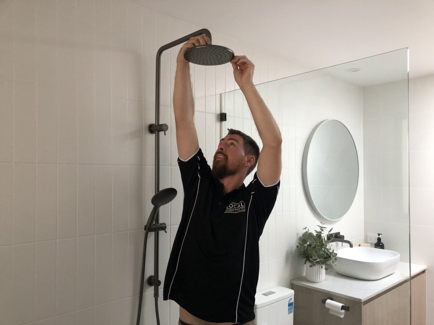 gold coast plumber installing shower set in new bathroom
