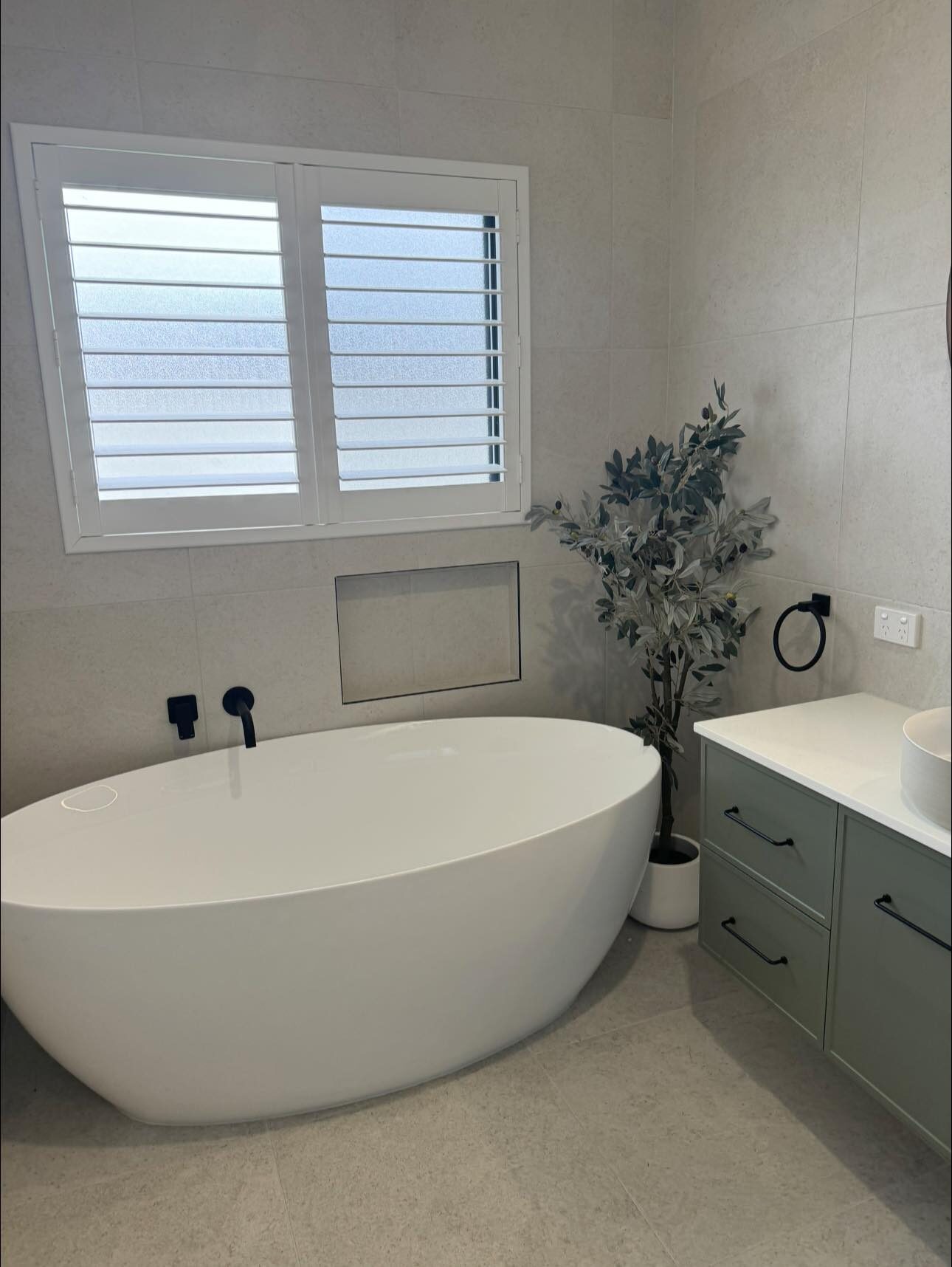 Freestanding modern bath installed during a bathroom renovation in Upper Coomera