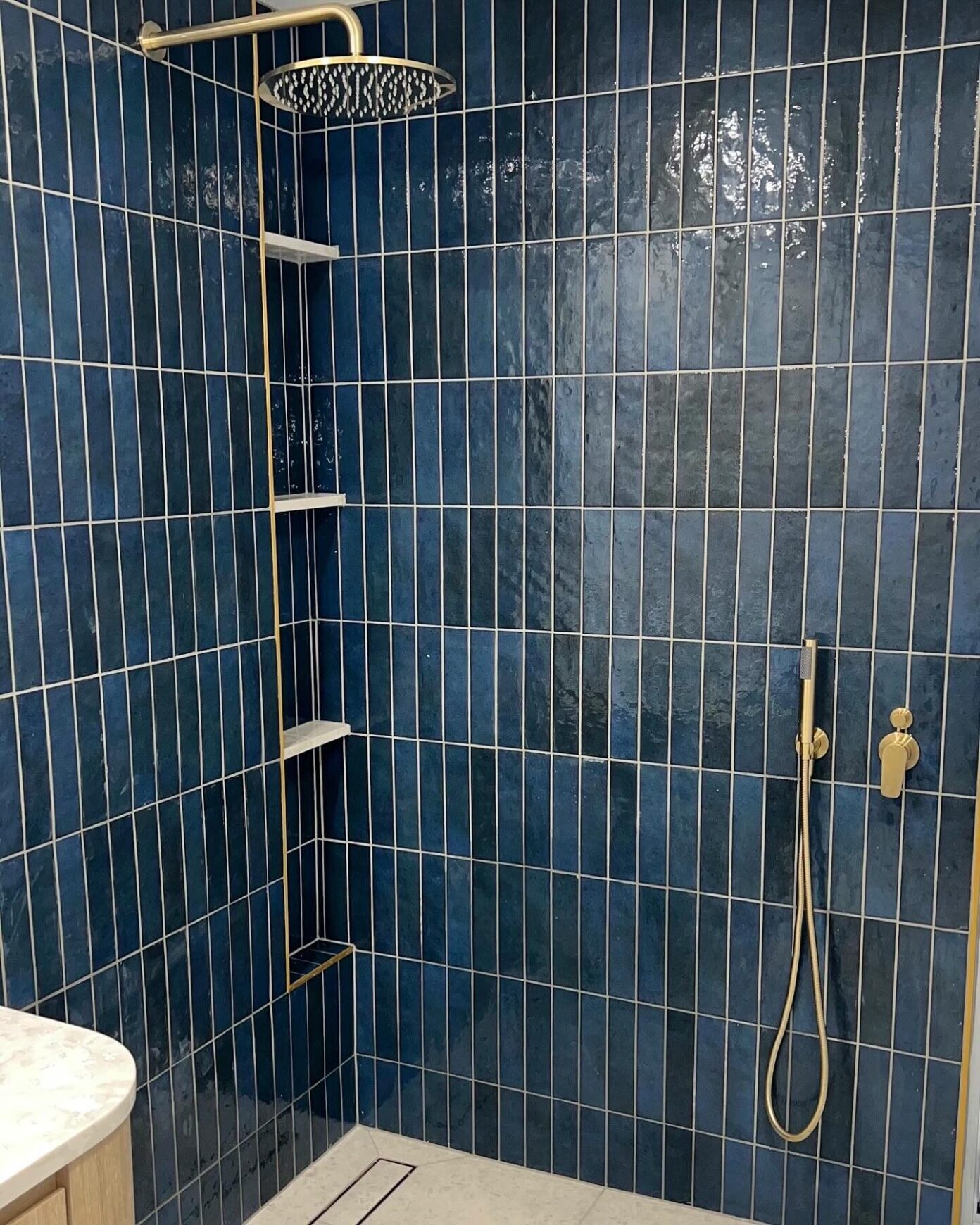 Designer bathroom with freestanding tub and scenic window view – Brisbane renovation by Local Plumbing & Gas Co