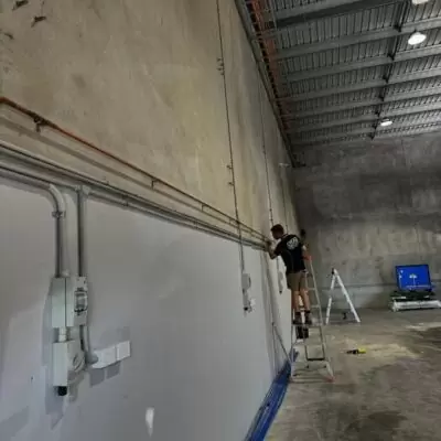 Commercial gas line installation inside warehouse by certified gas fitter.
