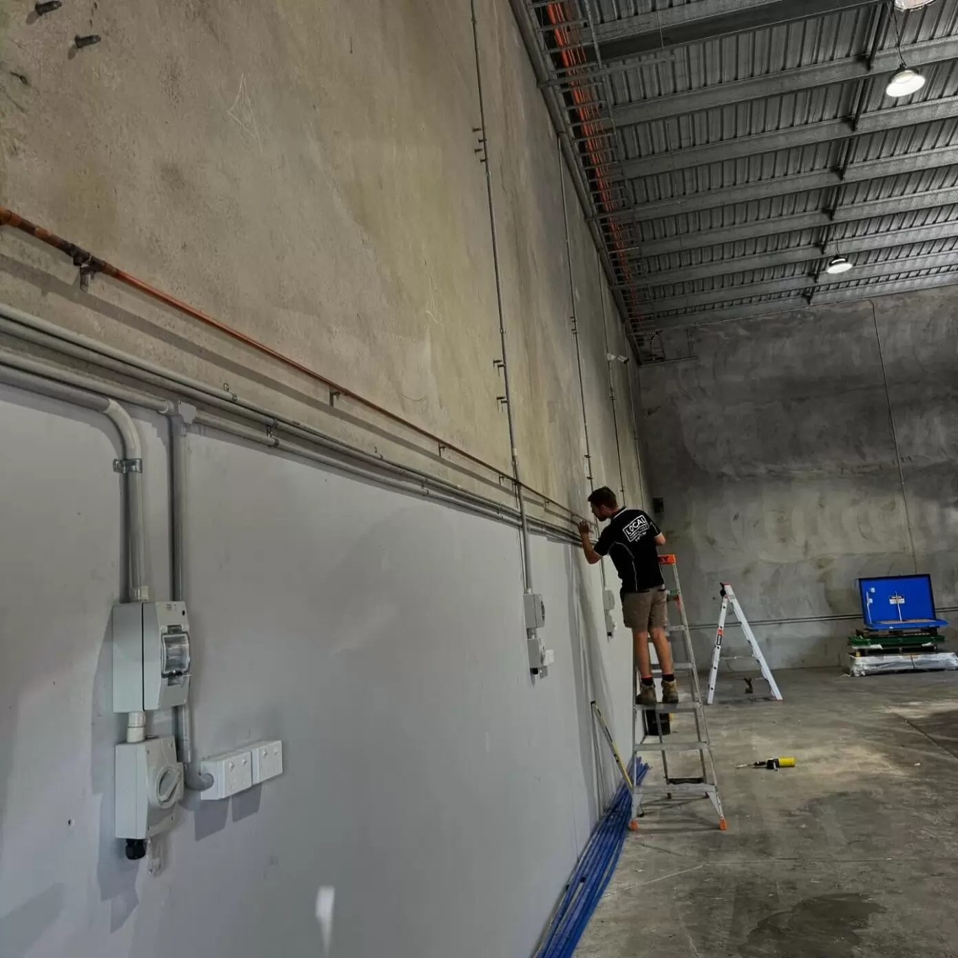 Licensed gas plumber installing copper gas lines at a commercial property in Molendinar, Gold Coast