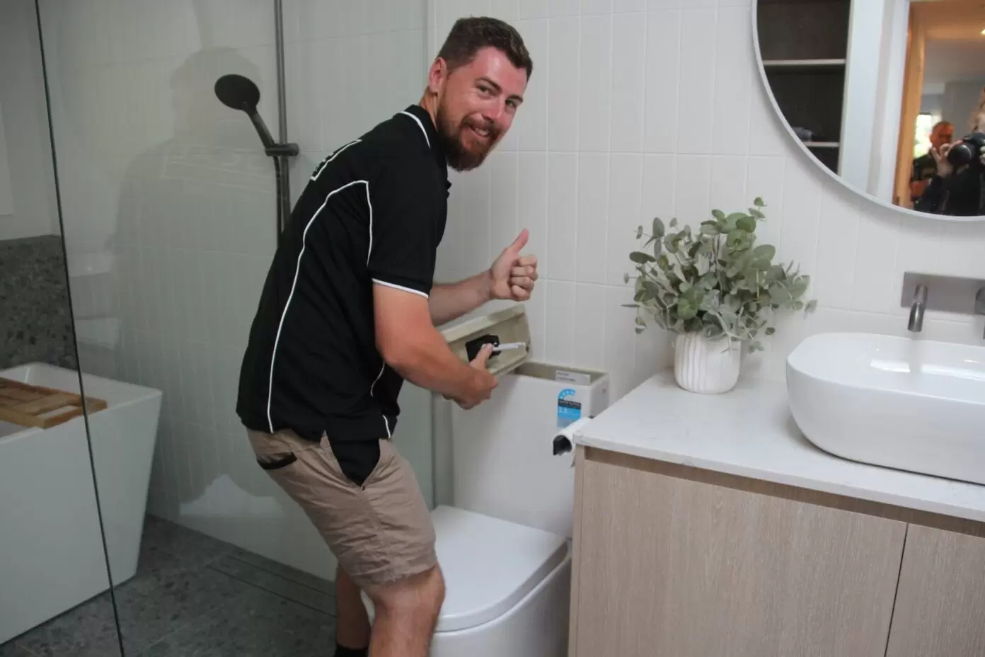 Gold Coast toilet repairman fixing toilet in bathroom