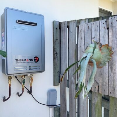 Thermann gas continuous flow hot water unit mounted on wall.