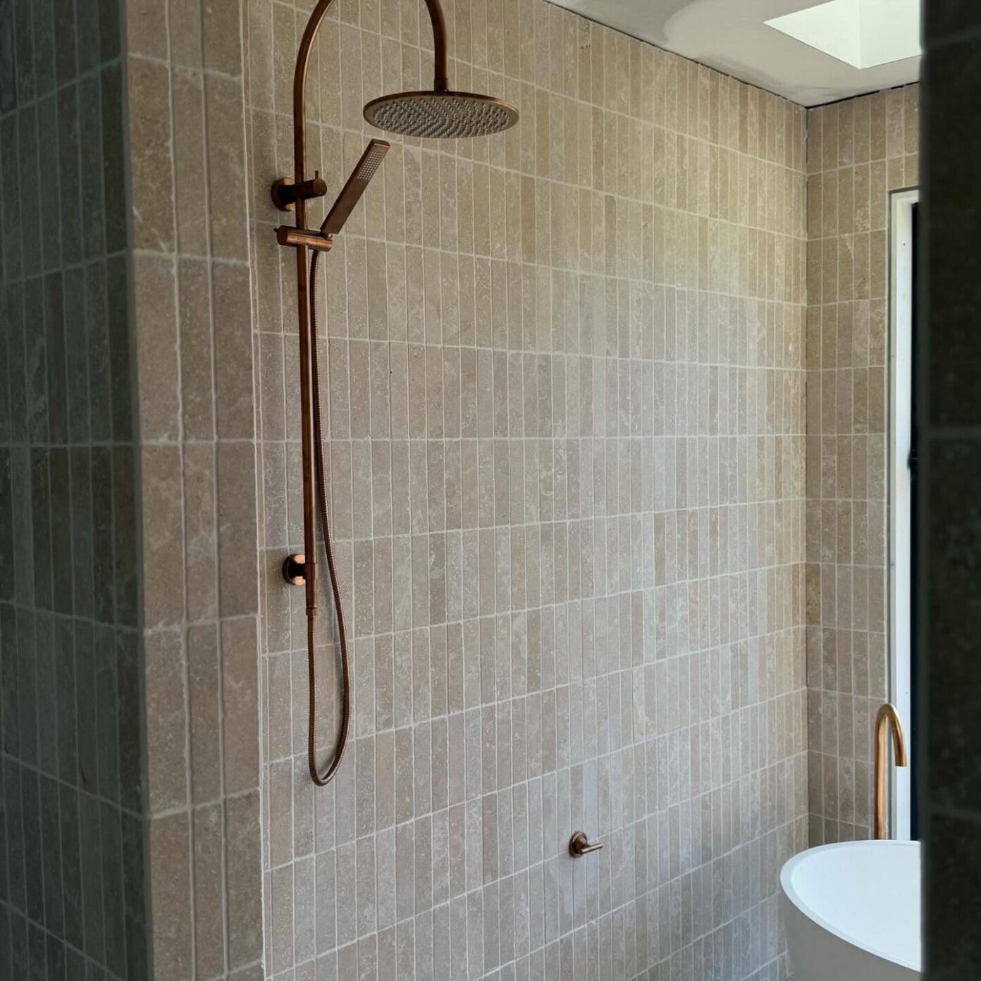 Bold blue tiled shower with gold fixtures – bathroom upgrade at Weatherly Barns, Jimboomba