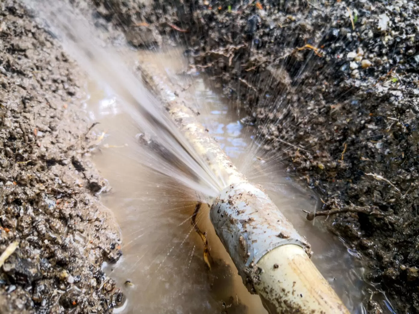 Burst underground water pipe spraying water during repair on the Gold Coast