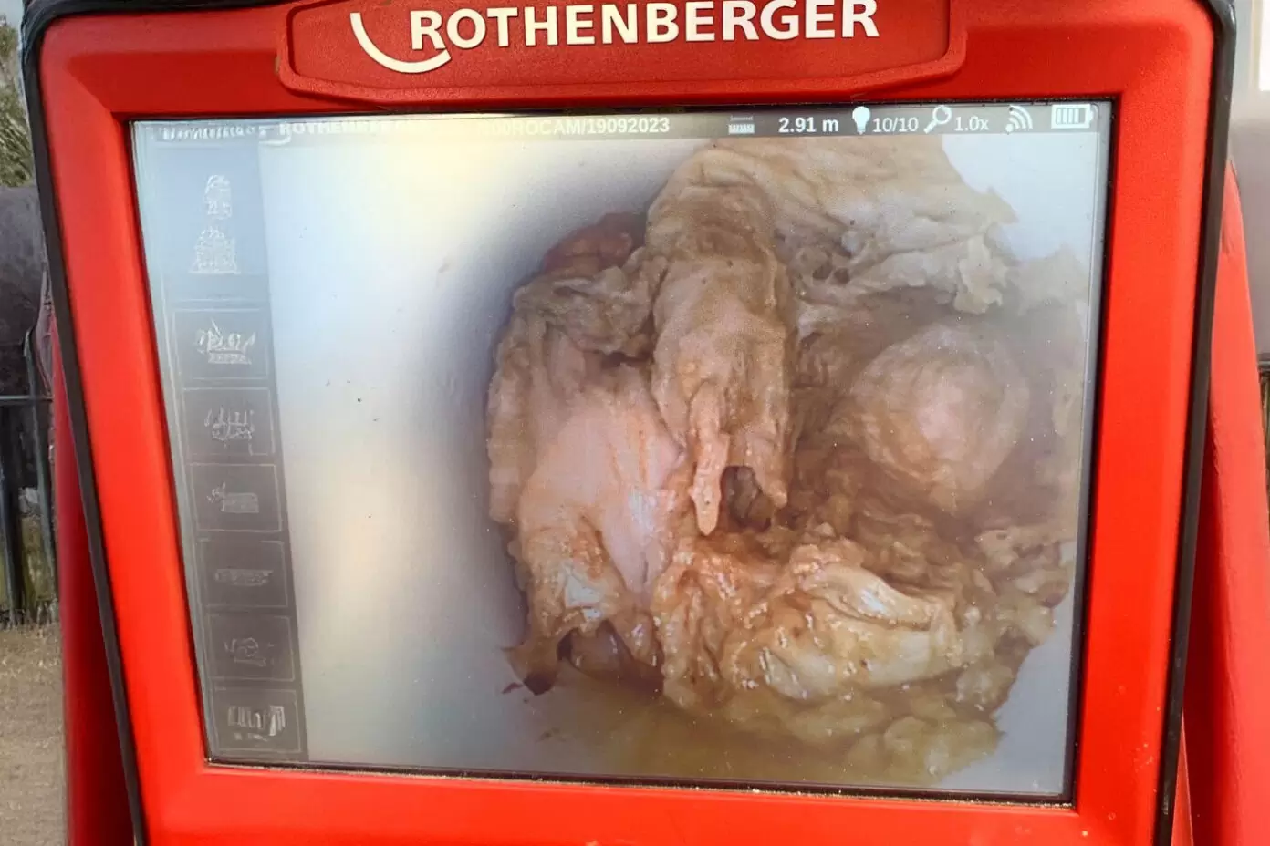 CCTV drain camera showing blockage inside a sewer pipe during inspection